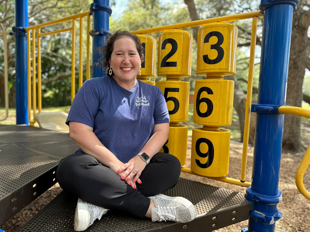 Speech Therapist, Sarah Cooper Pendergast, at the playground with a spinning number activity